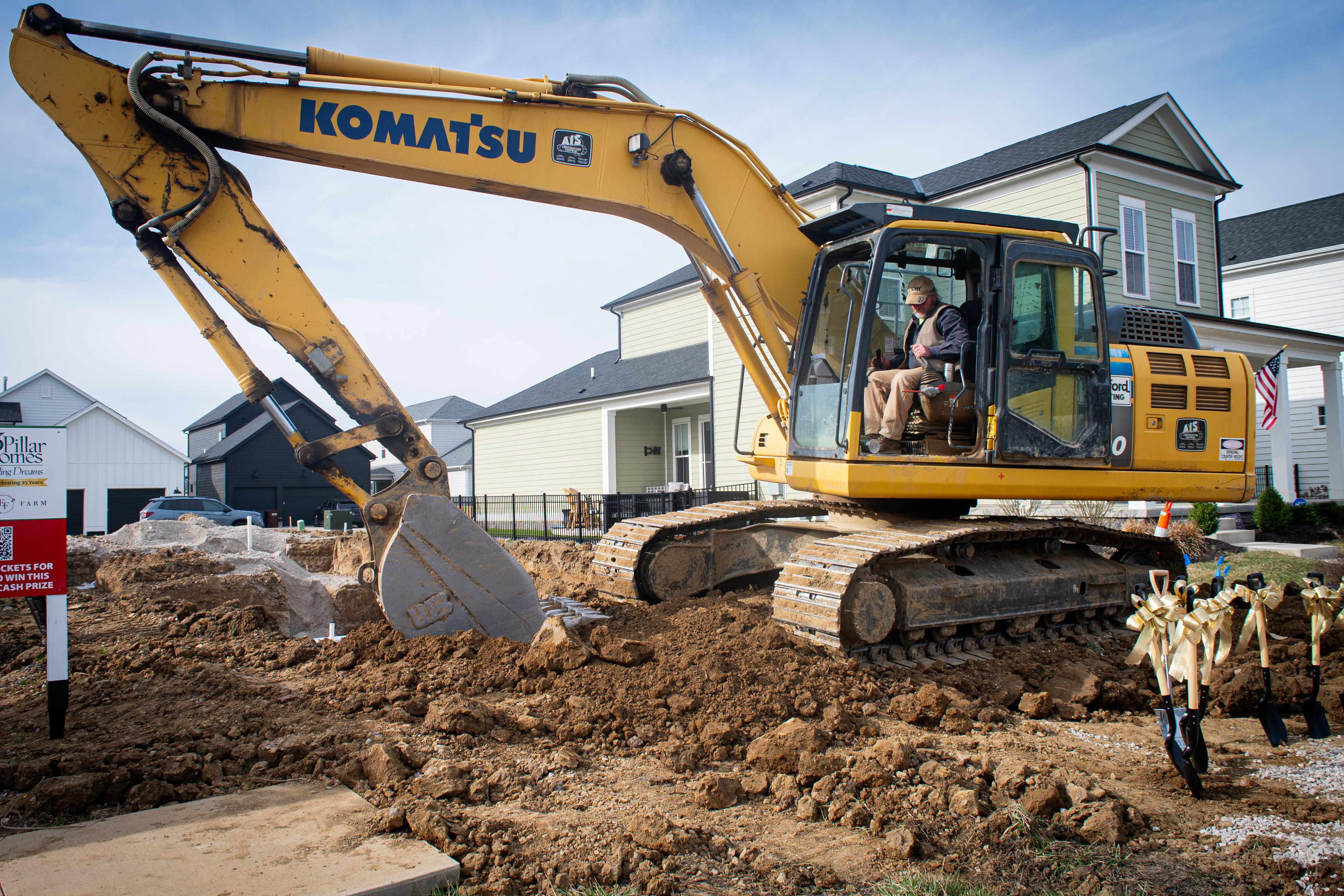 Home for the Holidays COL Komatsu truck digging at the building ceremony
