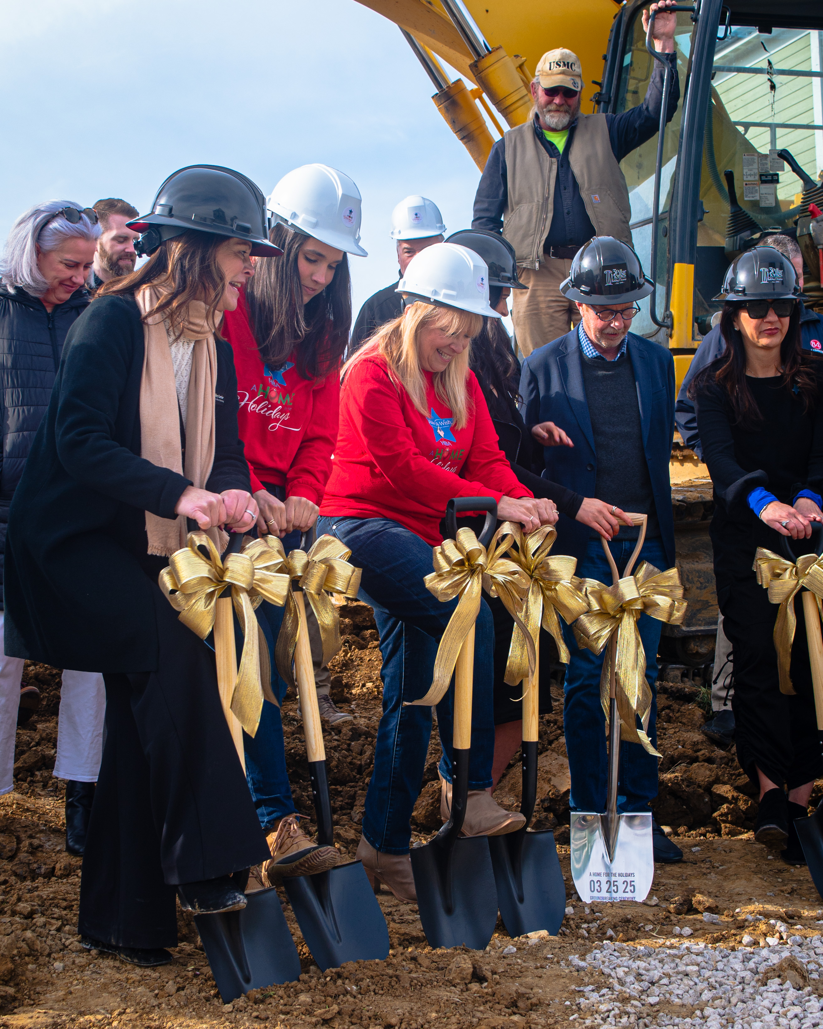 Home for the Holidays COL Shoveling into the ground at building ceremony